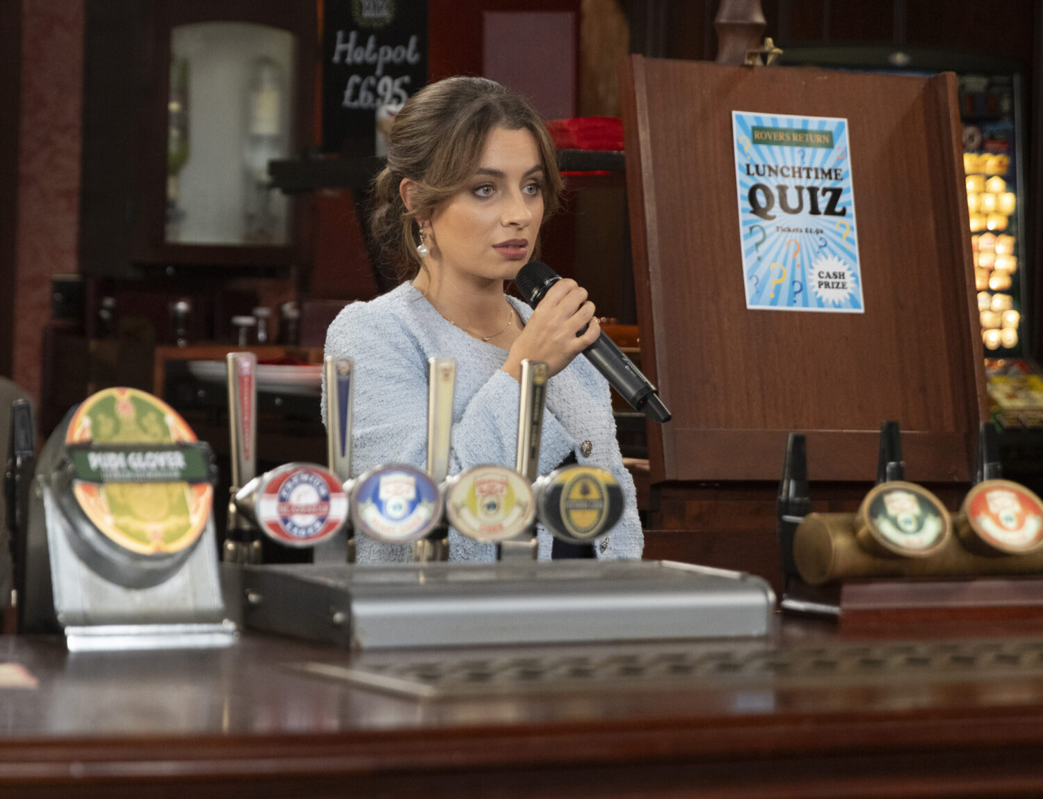 Daisy in the pub with microphone 