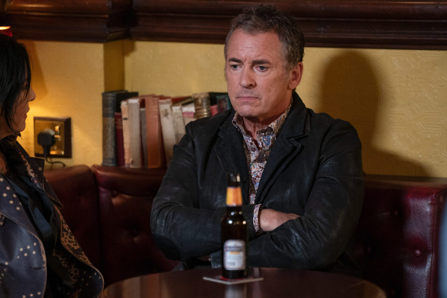 EastEnders' Alfie has his arms folded in the pub