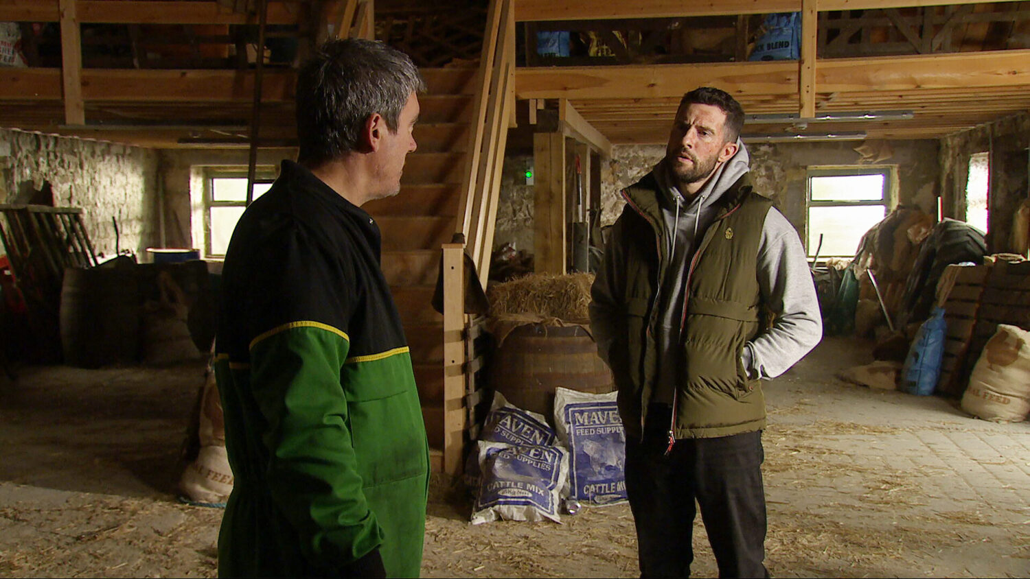 Cain and Ross are talking in the barn