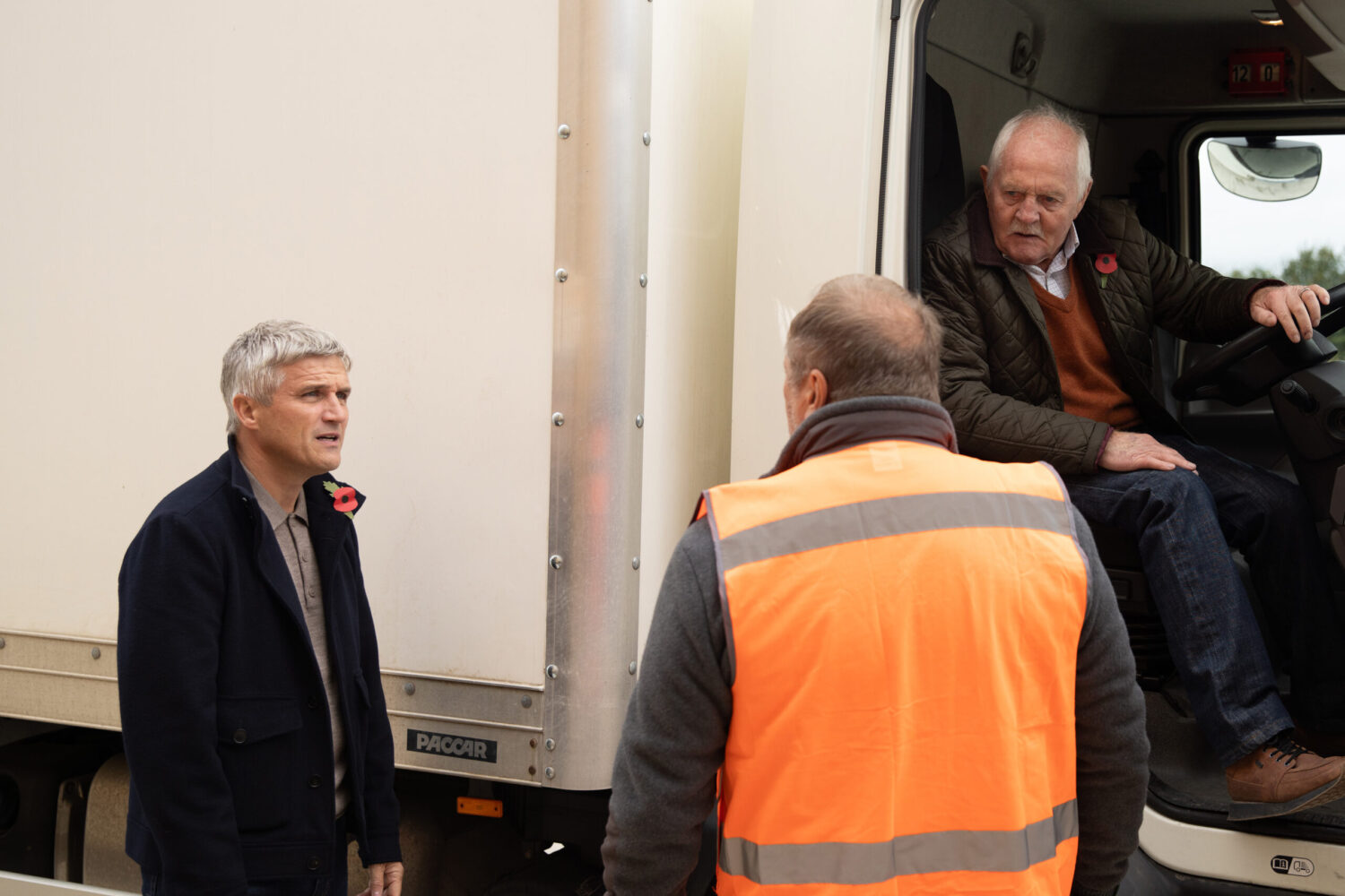 Emmerdale's Pollard, Caleb and Will by a lorry