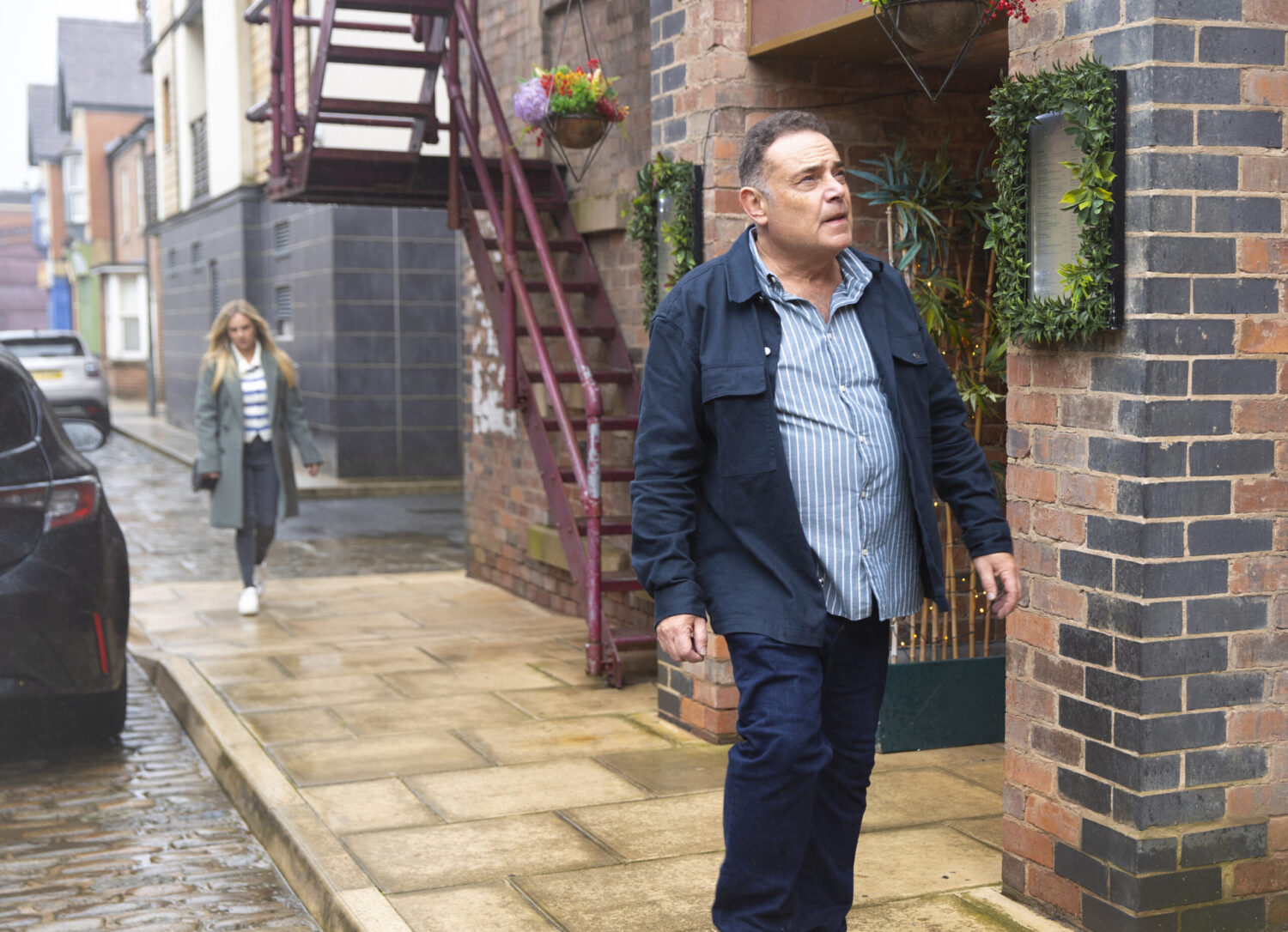 Coronation Street's Jesse is walking off from Sarah in the Street