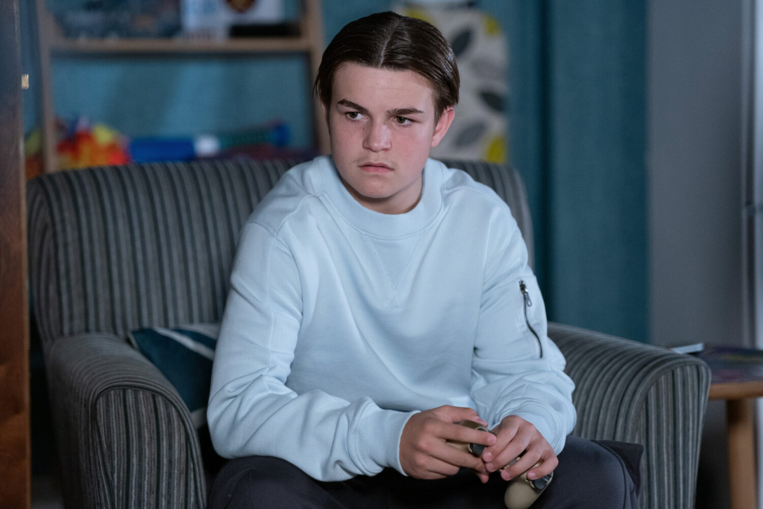 Tommy looks angry in EastEnders