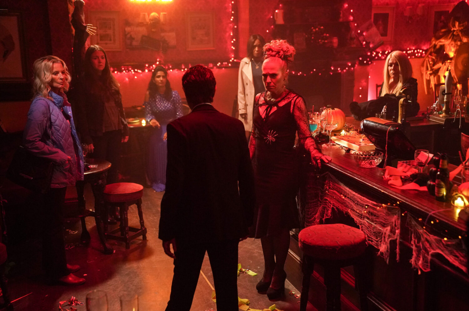 Nish in front of 'The Six' on Halloween in EastEnders