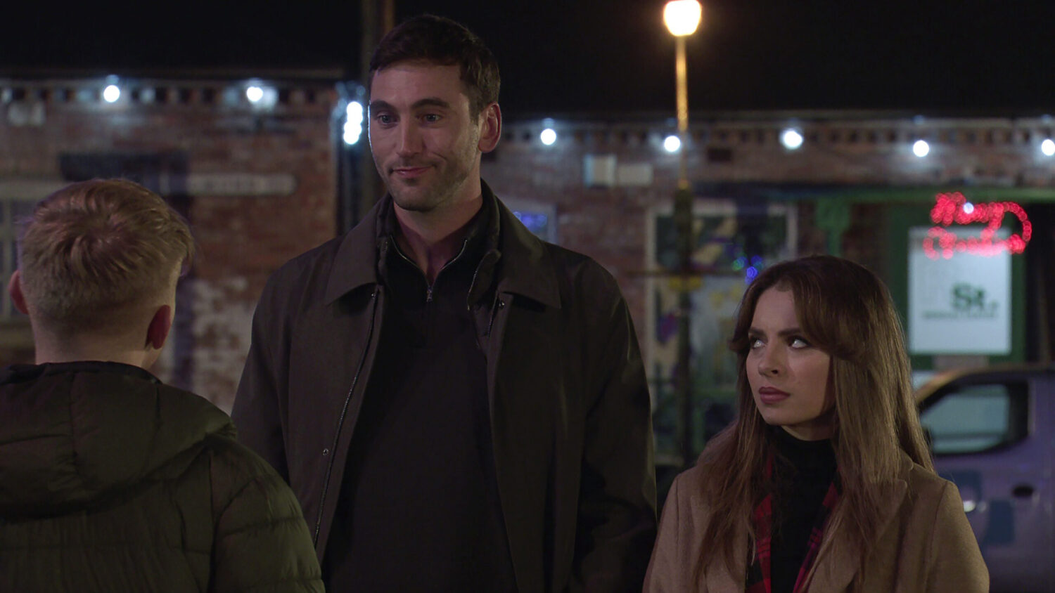 Daisy looks annoyed as Kit talks to Max on Corrie