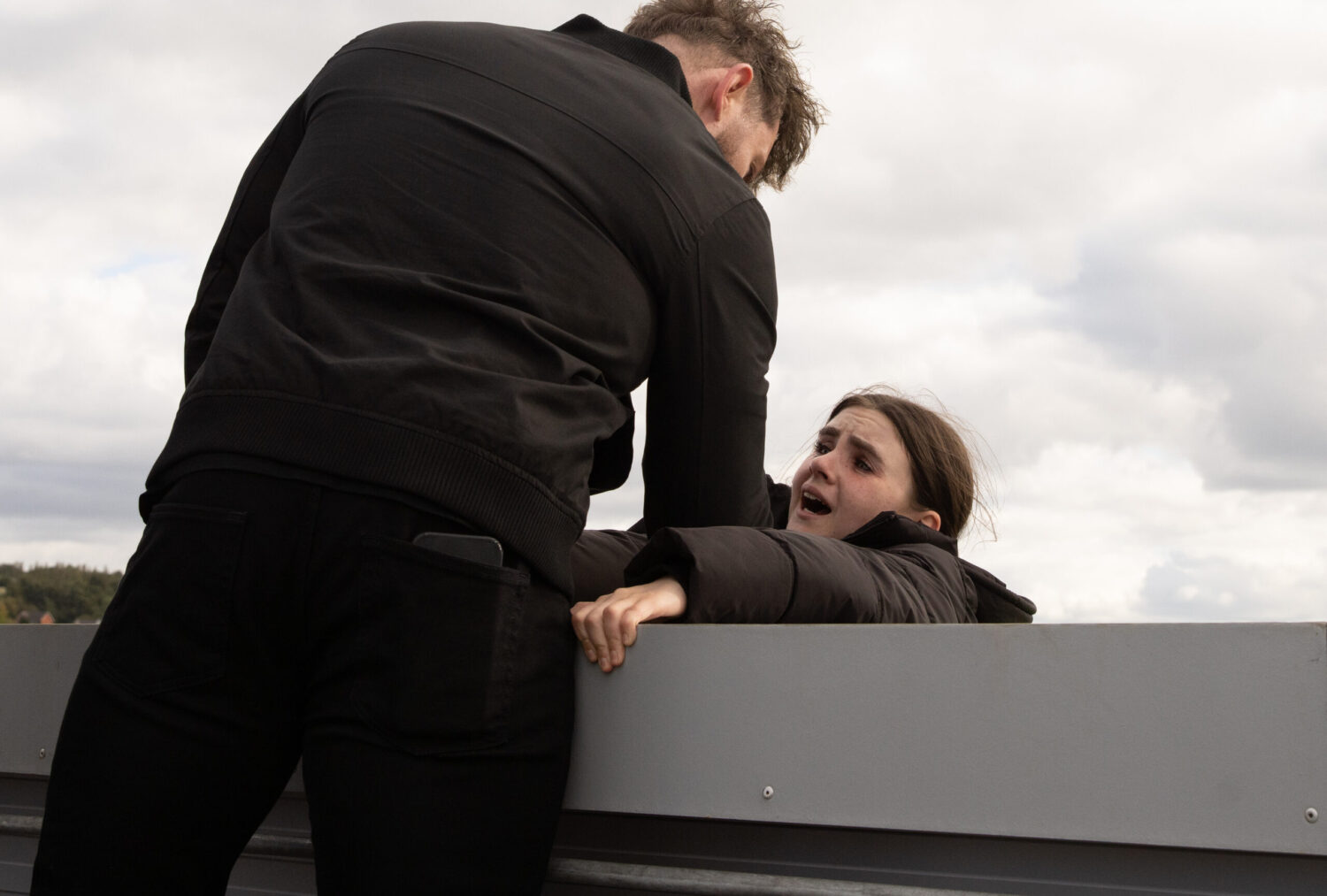 April being dangled over a car park edge on Emmerdale