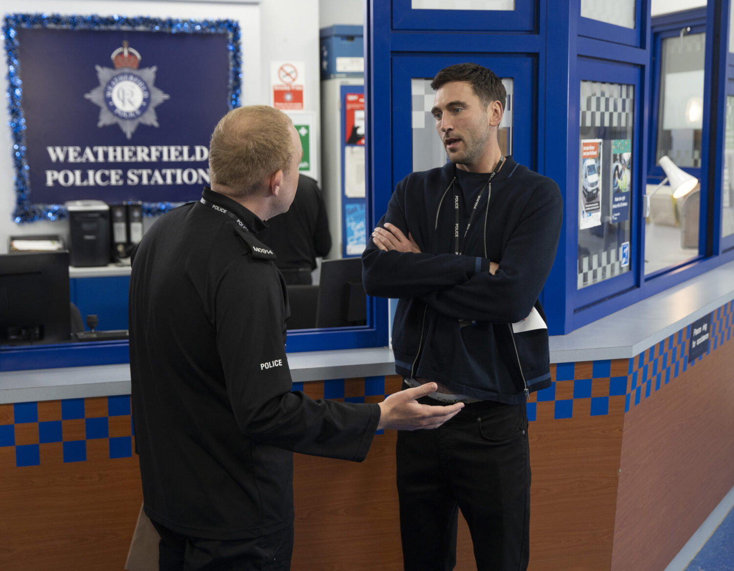 Kit and Craig talking at the station on Coronation Street