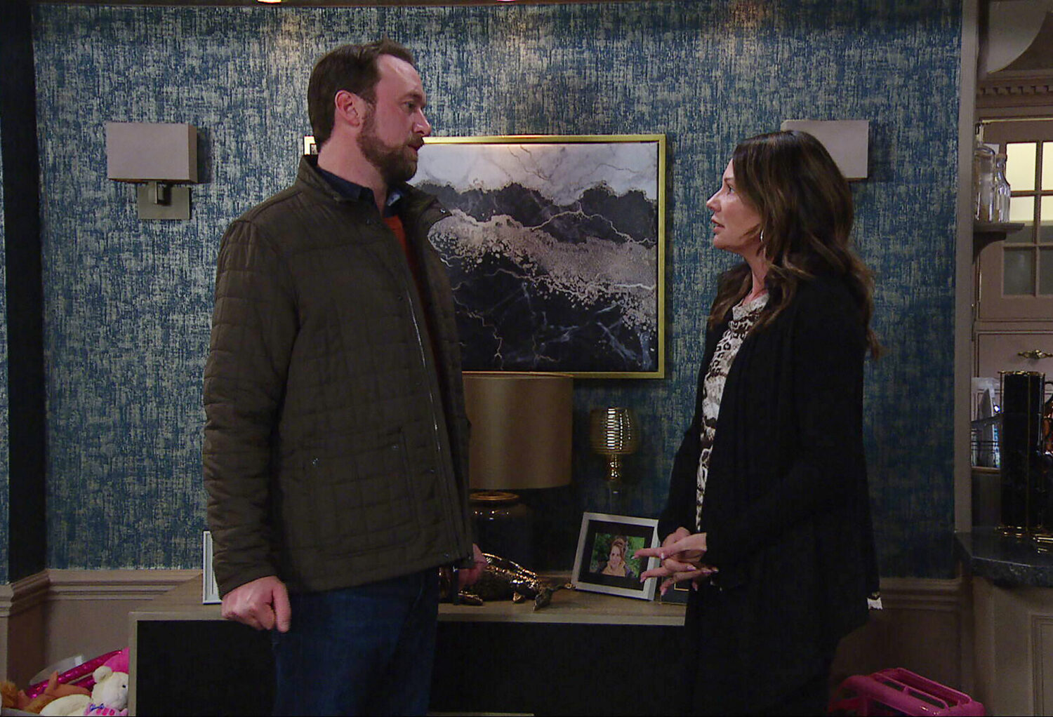 Liam and Chas talking in the back room of the pub