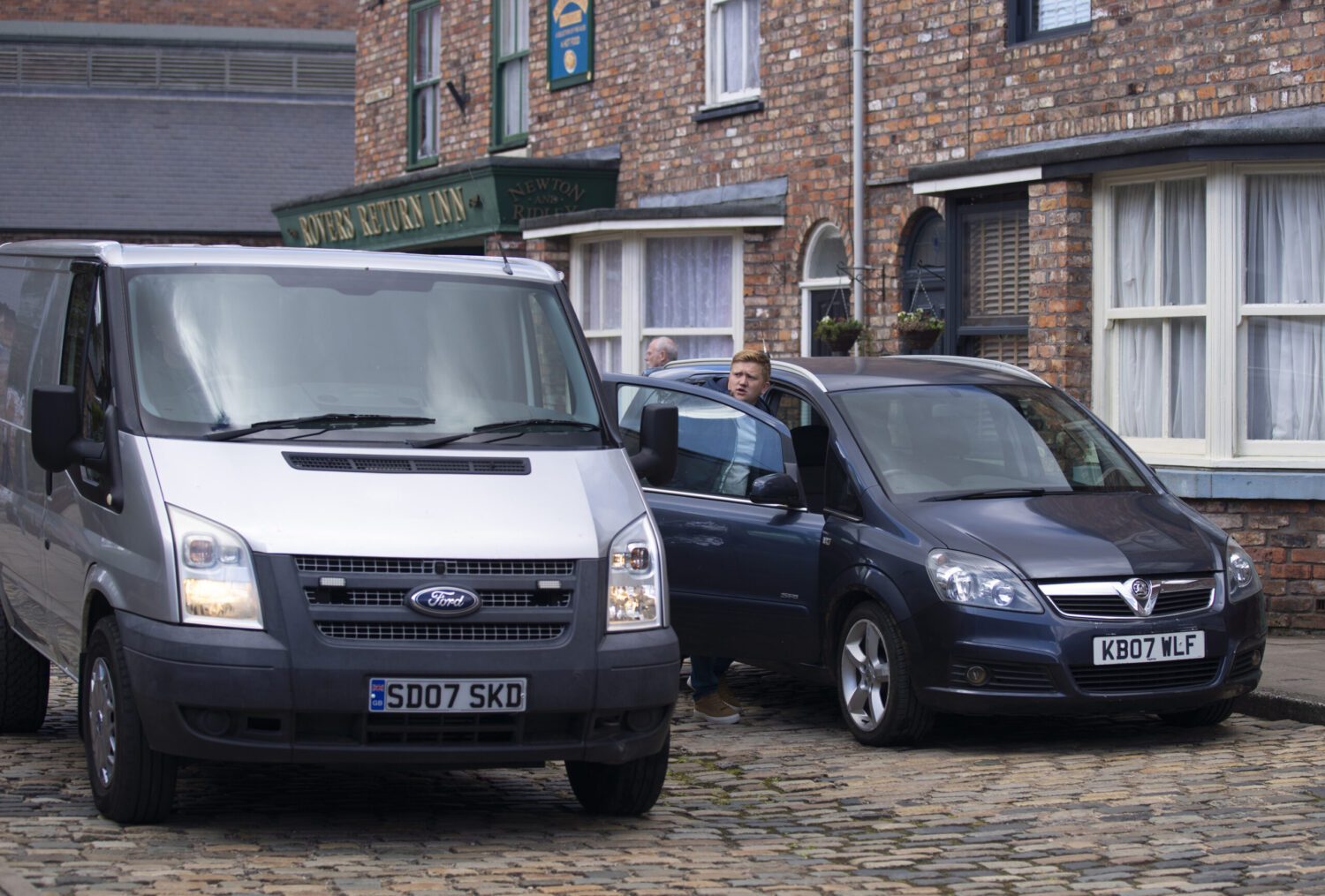 Corrie's Chesney is getting into his car next to a van