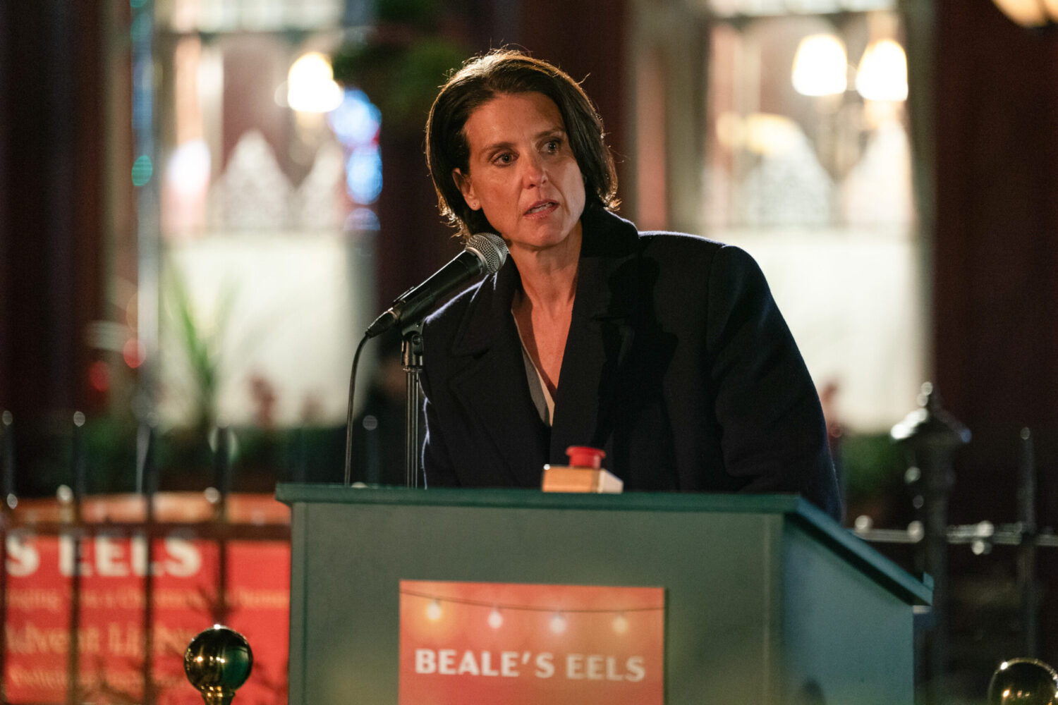 Eve talking to a crowd in EastEnders