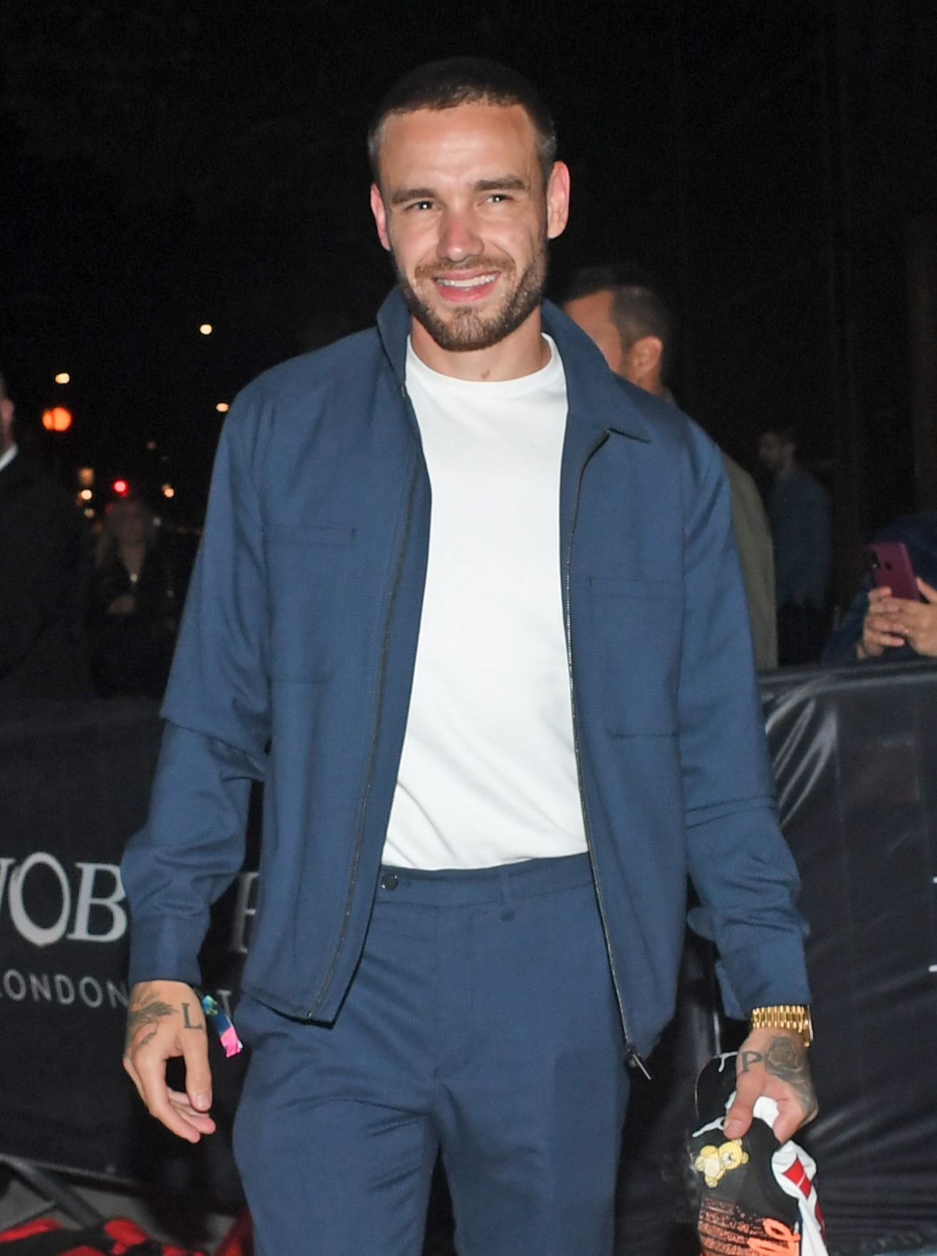 Liam Payne in a blue jacket and white T-shirt