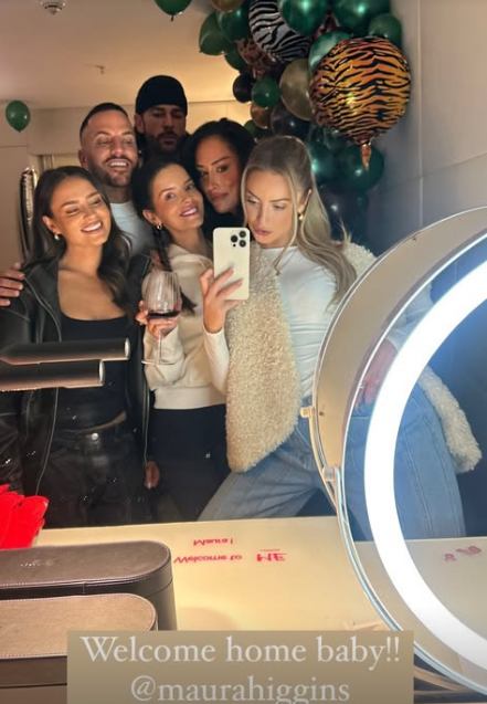 Maura Higgins and Pete Wicks pose with friends for a selfie in a London hotel