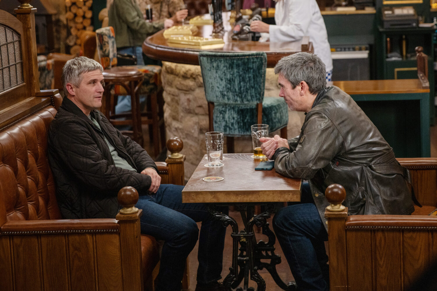 Caleb and Cain talking in the Woolpack in Emmerdale