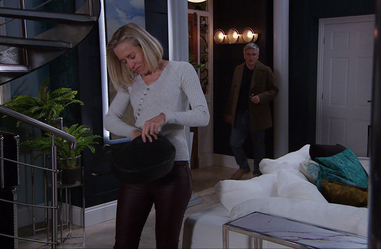 Emmerdale's Ruby looking into a bag