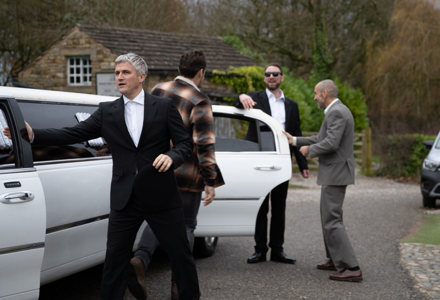 Caleb, Liam, Mack and Sam by the limo in Emmerdale
