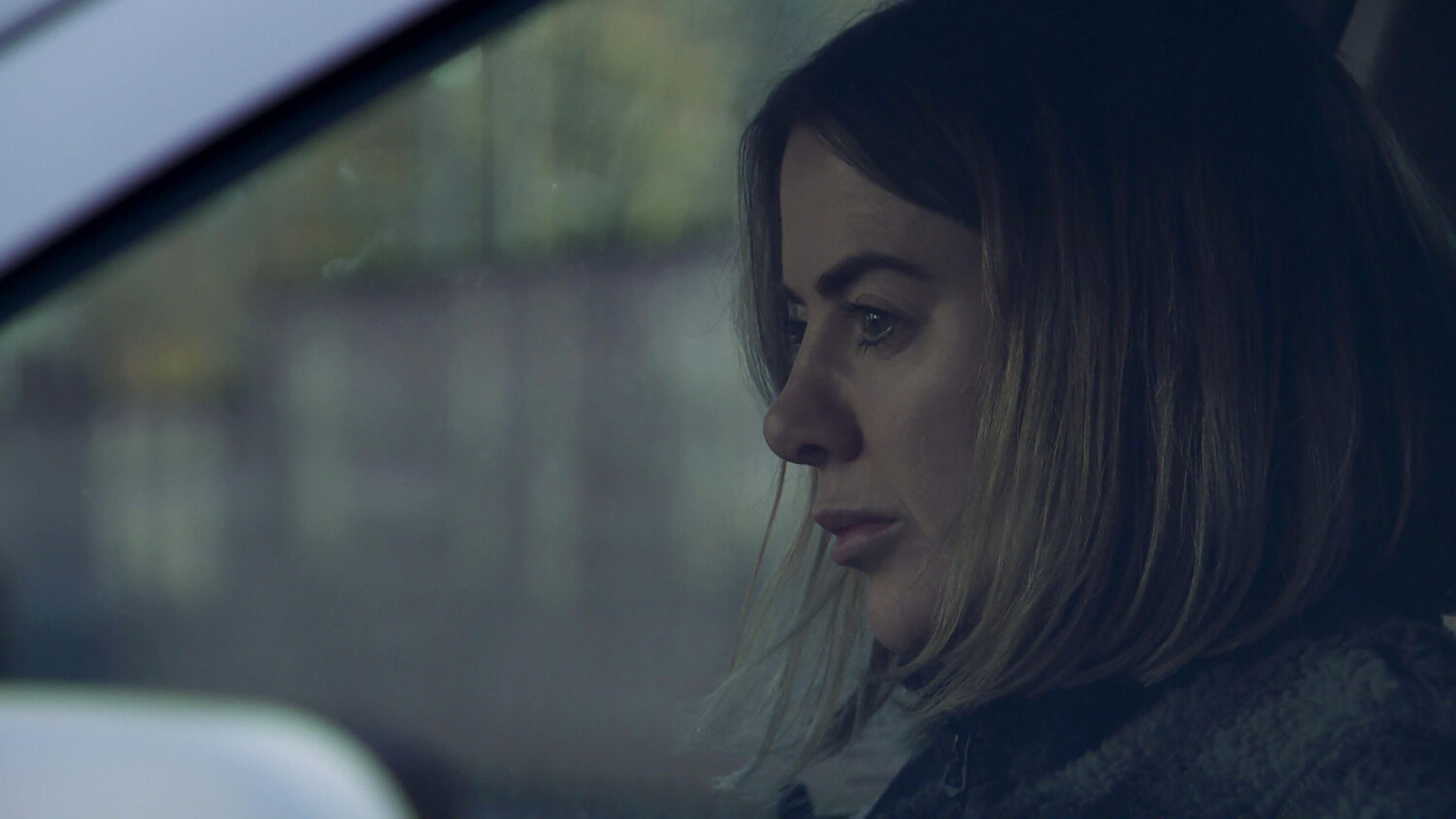 Abi sitting in her car