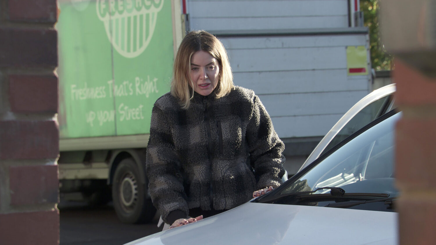 Abi by her car on Corrie