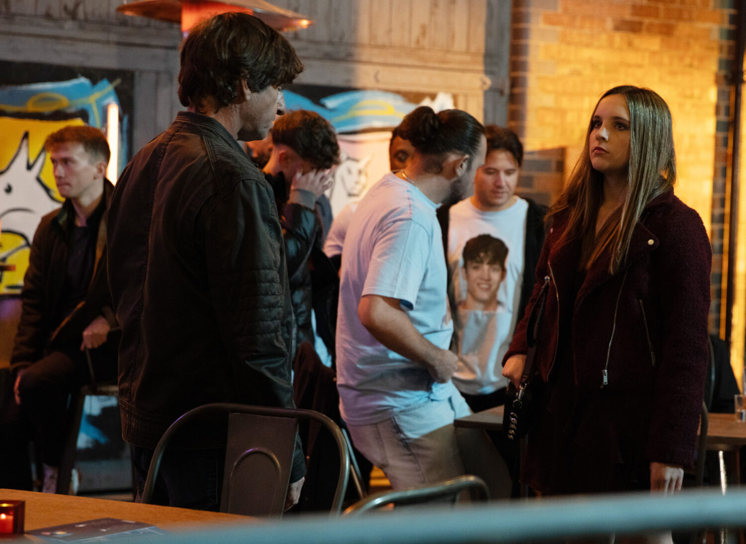 Amy talking to Eric on a night out