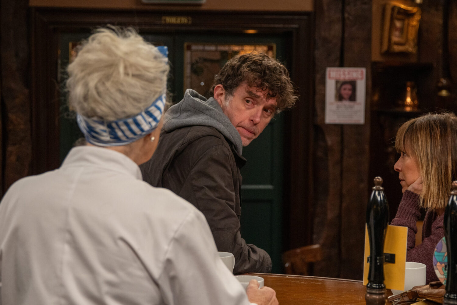 Marlon talking to Mary and Rhona in pub