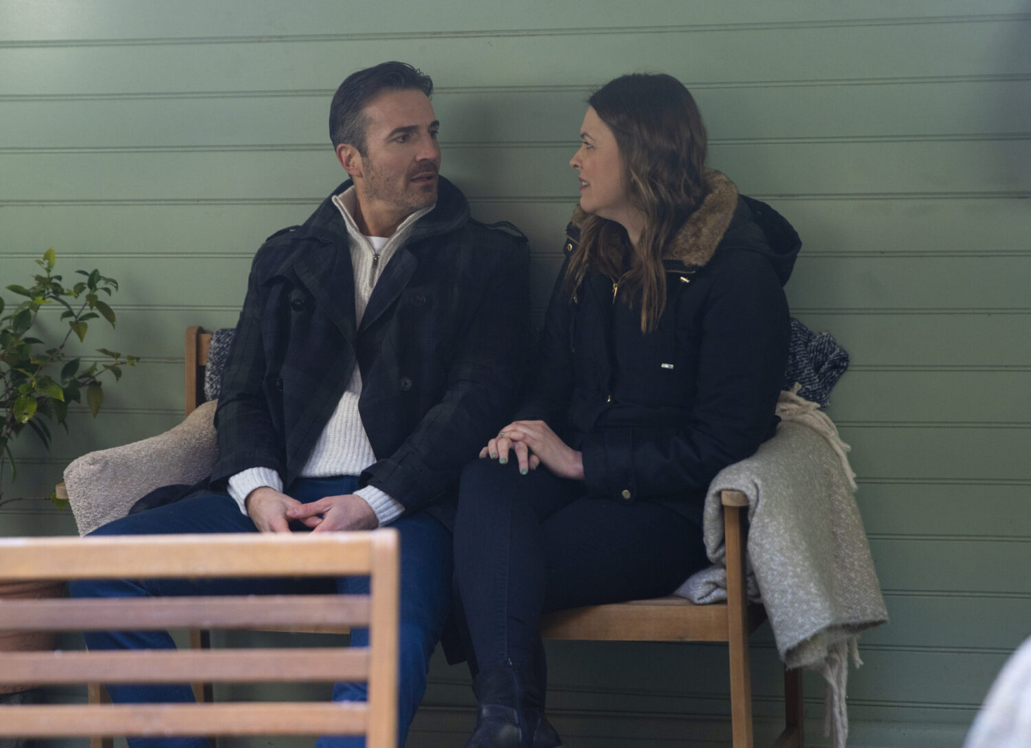 Tracy and Tommy sitting on a bench