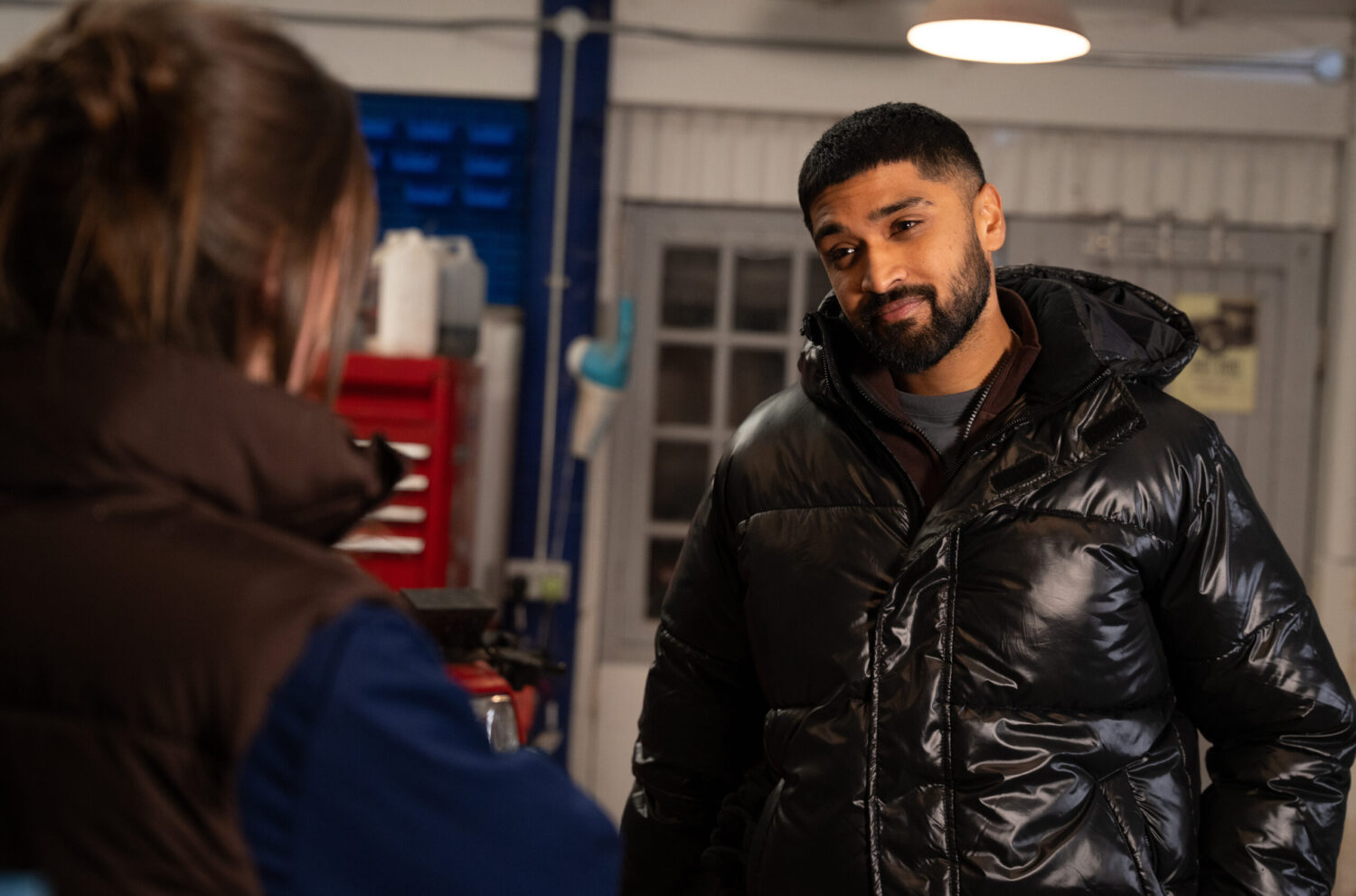 Sammy talking to Sarah at the garage