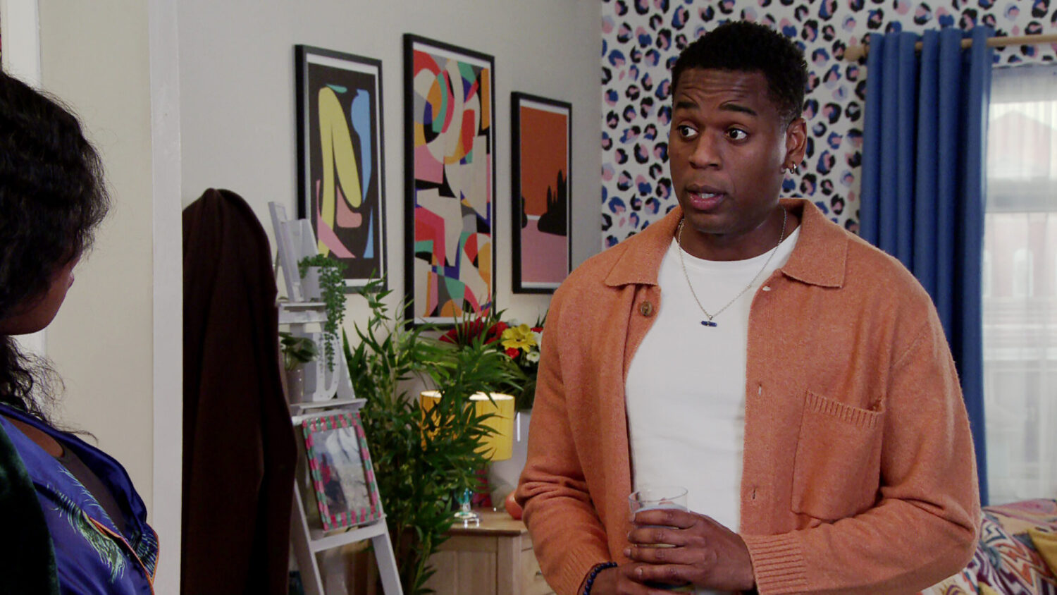 James talking to Dee-Dee in the flat