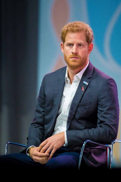 Prince Harry sitting down in suit